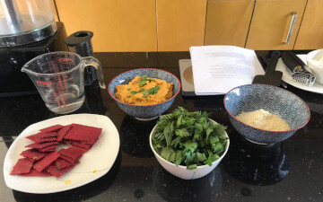 Beetroot crackers, carrot hummus, carrot top pesto